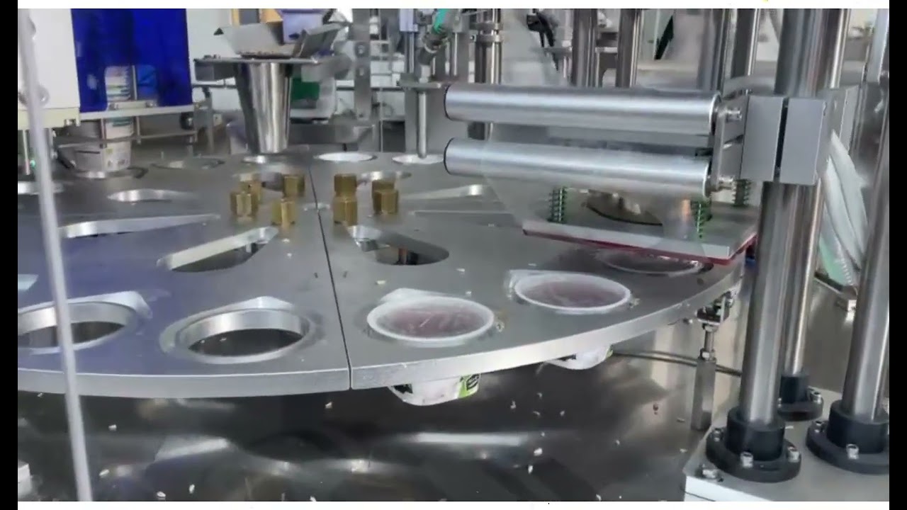 AUTOMATIC ROTARY-FILLINGSPRINKLING-CAPPING MACHINE