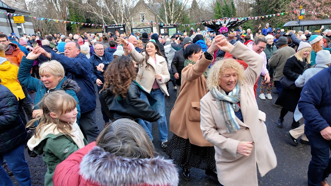 Crowds join in Military Two Step Scottish dance street Ceilidh Pitlochry New Year 2025 Street Party