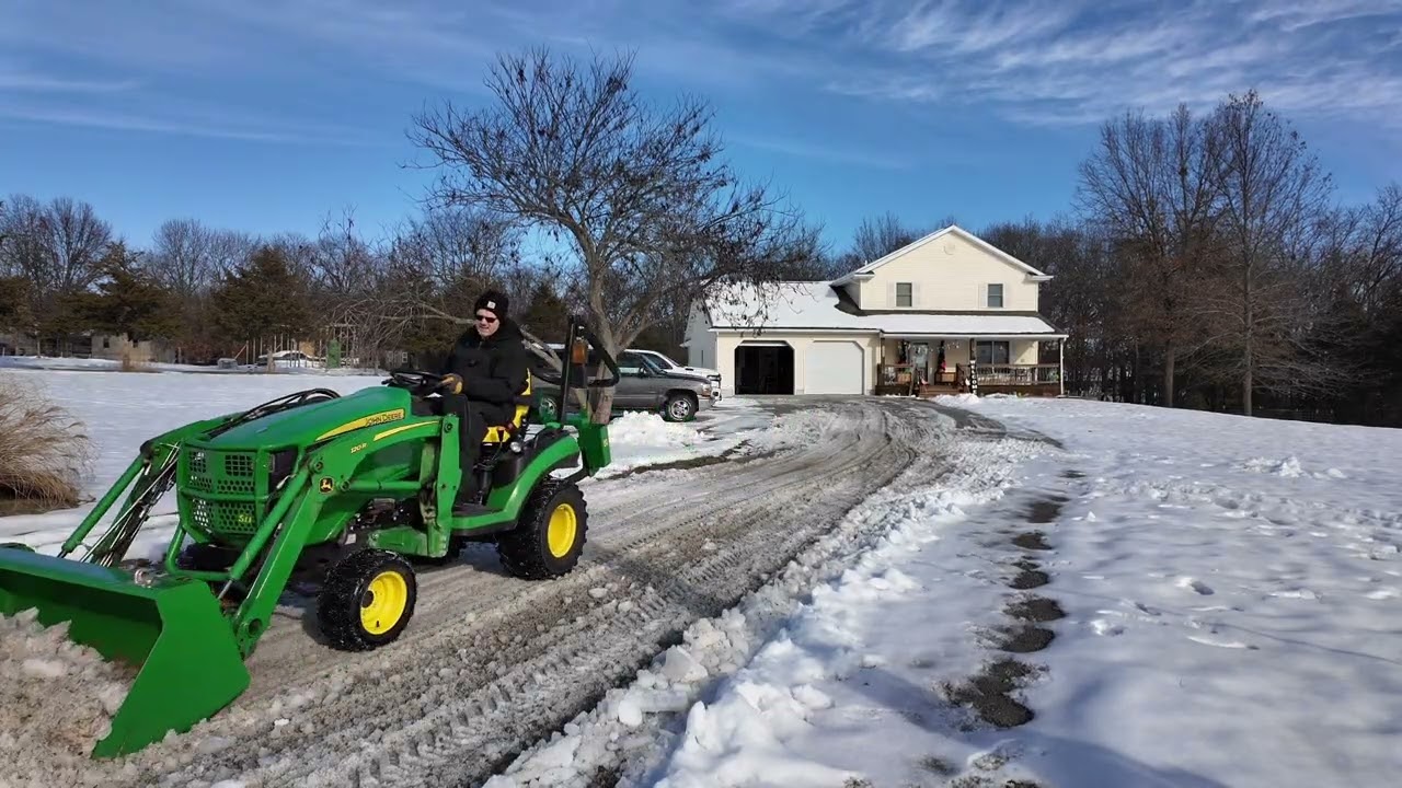Breaking ice on gravel driveway 