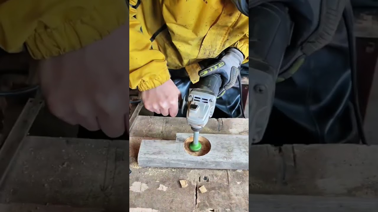 Drilling a hole into a wood block with a hammer and then smoothing it using an electric grinder tool