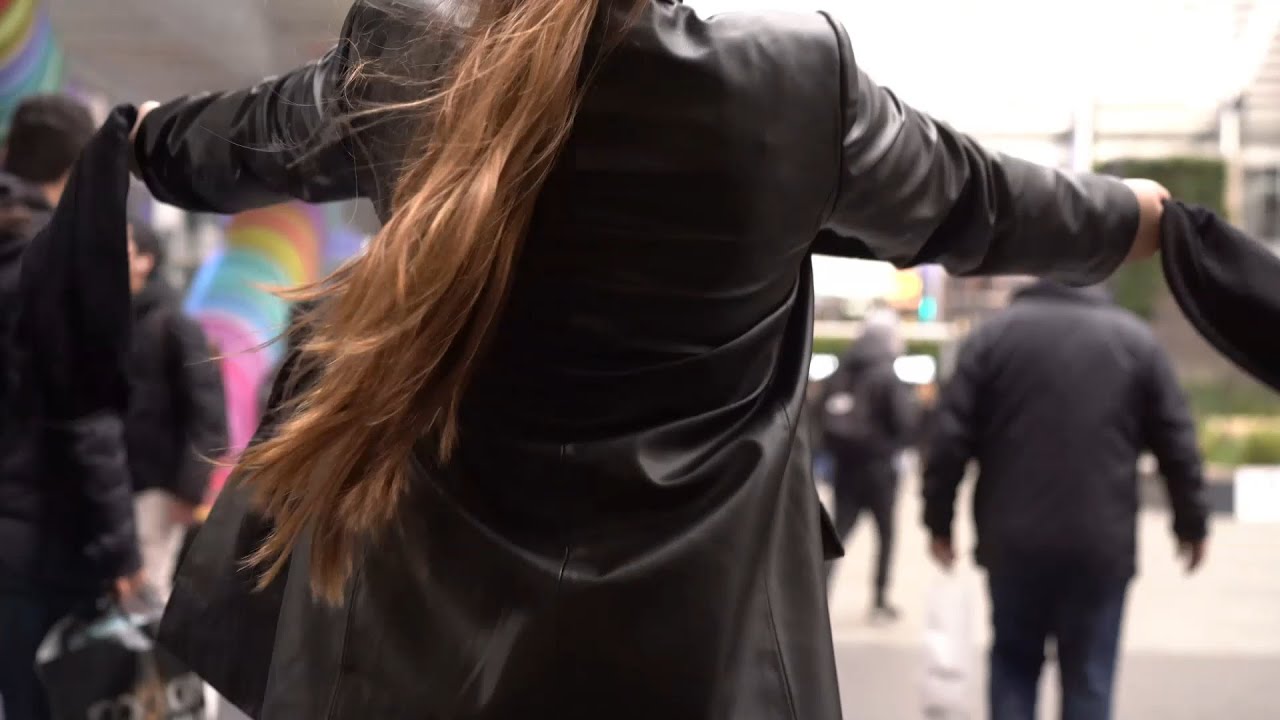 Girl in leather gloves with leather jacket and leather boots with leather pants