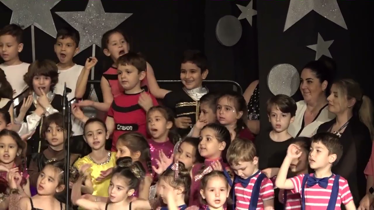 Ela and her school mates singing in a choir at Eyuboglu