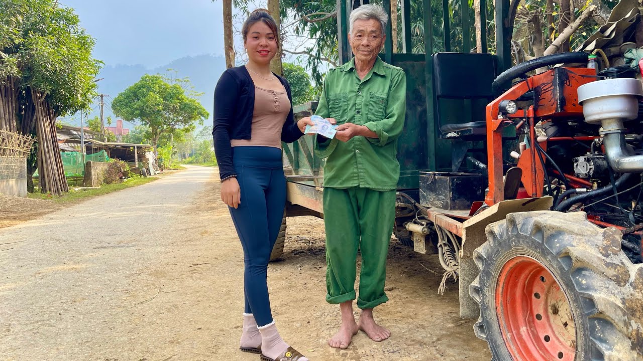 Female mechanic: repairing and restoring a tractor for her elderly neighbor.