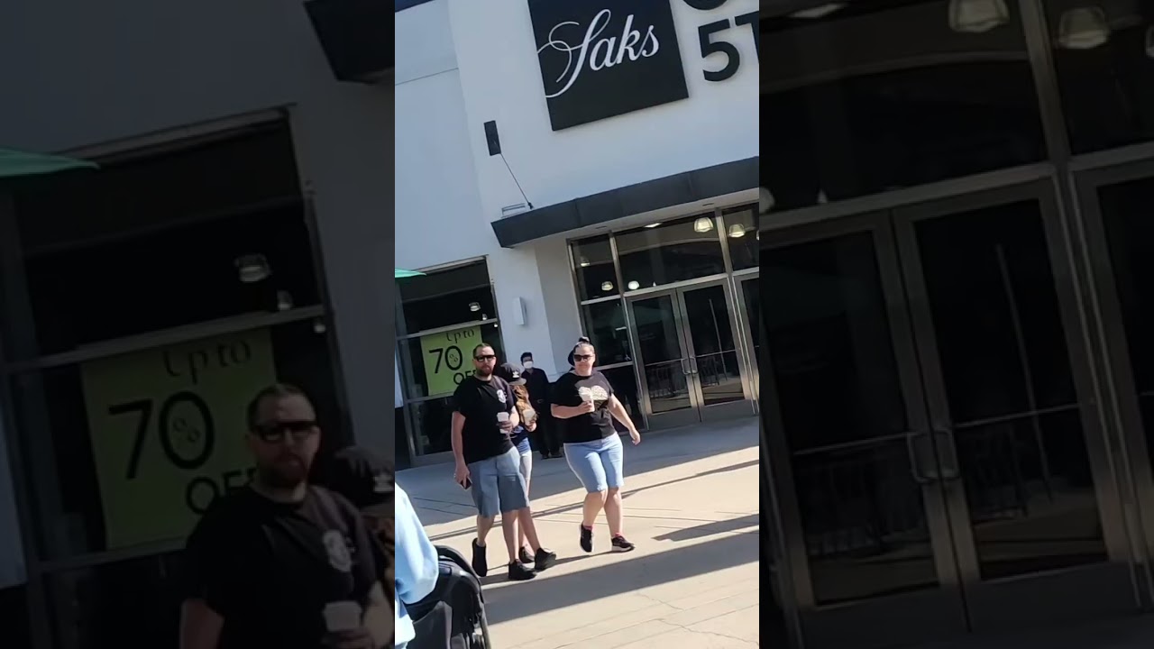 Starbucks banners and Tire pineapple ring hybrid statue at Orange Outlet mall California (10/3/2023)
