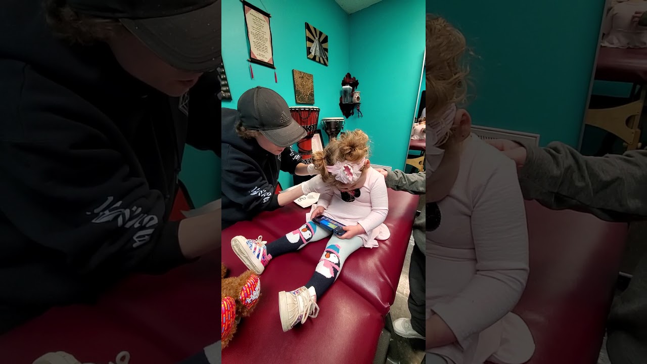 3 year old getting ears pierced at Tattoo shop/Body piercers