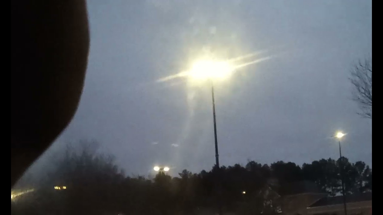 Parking lot lights switch on at 5:34 .P.M