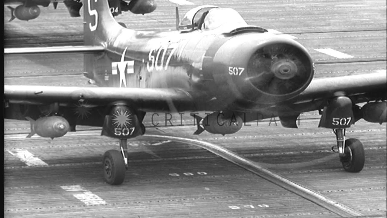 US Navy AD Skyraiders and F4U Corsairs take off from the deck of USS Valley Forge...HD Stock Footage
