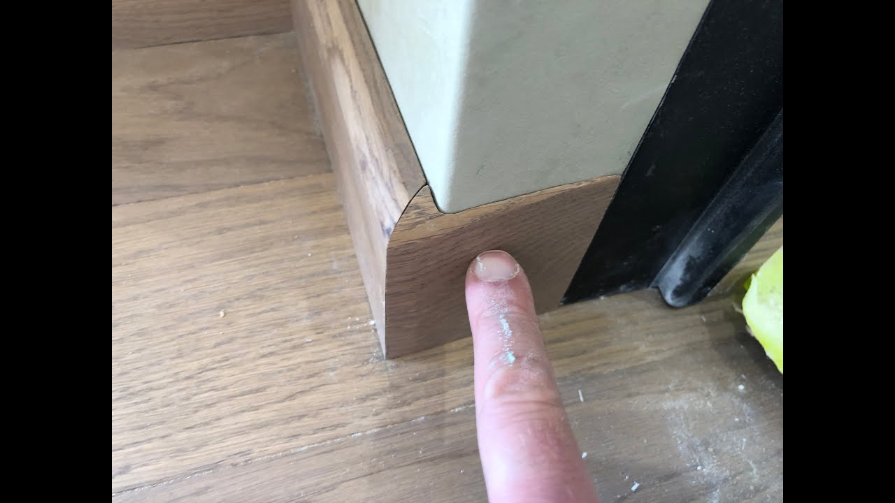 Installation of Oak skirting boards for concealed installation doors...