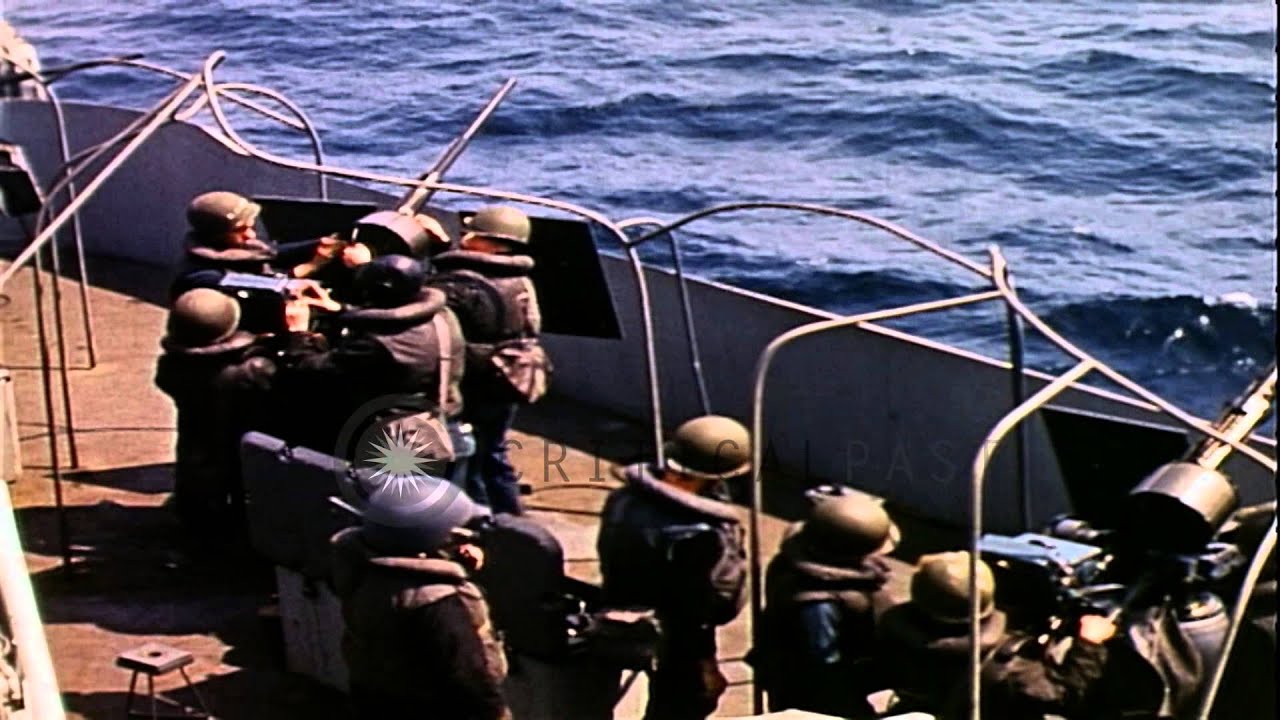 Three 20mm anti aircraft gun crew members fire a gun during the invasion of Norma...HD Stock Footage