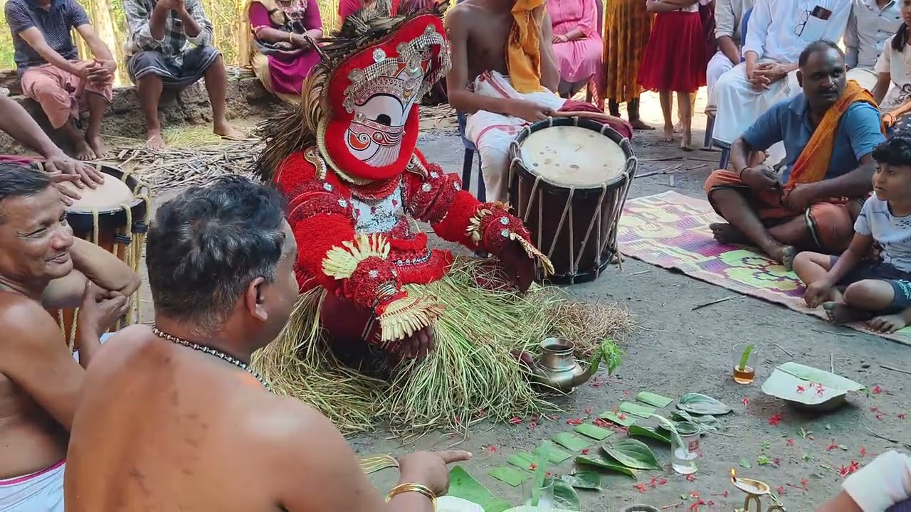 പൊട്ടൻ തെയ്യം  കുട്ടികൾക്ക് ചോറ് കൊടുക്കൽ ചടങ്ങ്, ചെങ്ങാനാർ തറവാട് മാവിച്ചേരി 