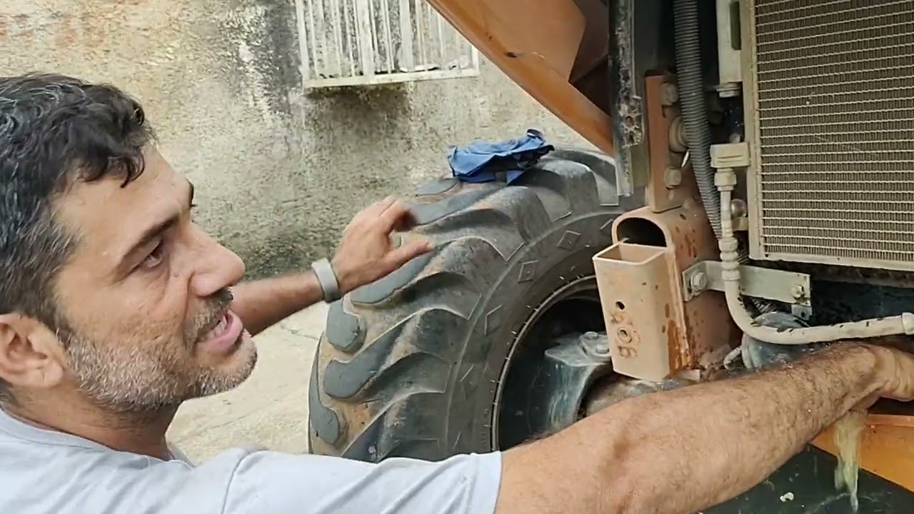 Trocando líquido de arrefecimento da retroescavadeira CASE 580N(radiador)