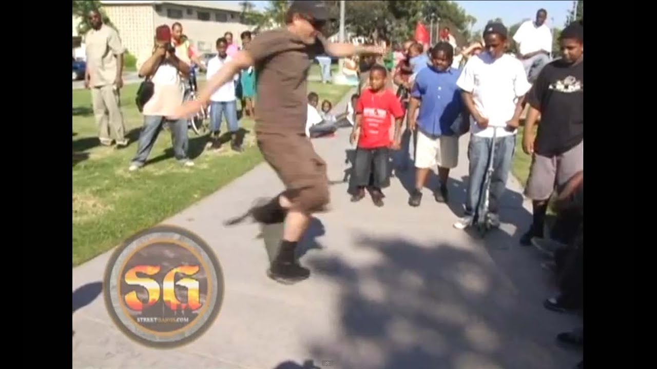 Stacy Peralta teaching skateboard tricks in the Jungles, South LA