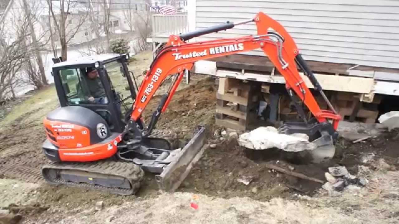 Digging out under barn with Kubota 057