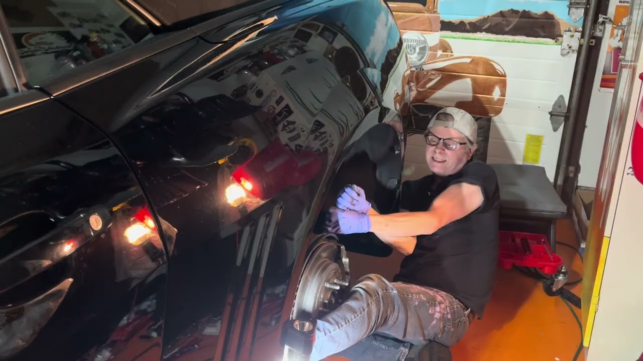 Removing the rear caliper & pads and caliper bracket.