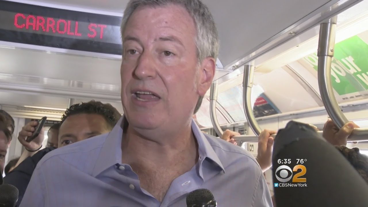 De Blasio Takes To Subway, Slams Cuomo