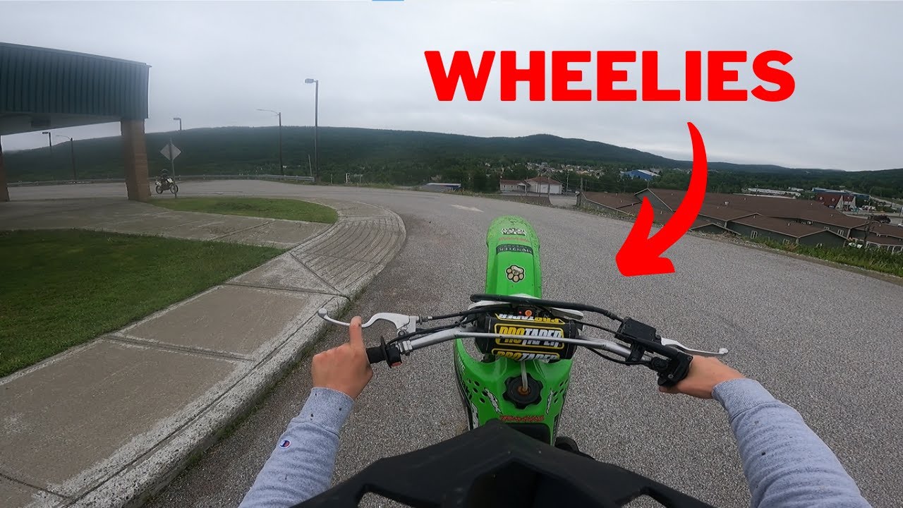KLX 140 WHEELIES AND RIDING THROUGH TOWN