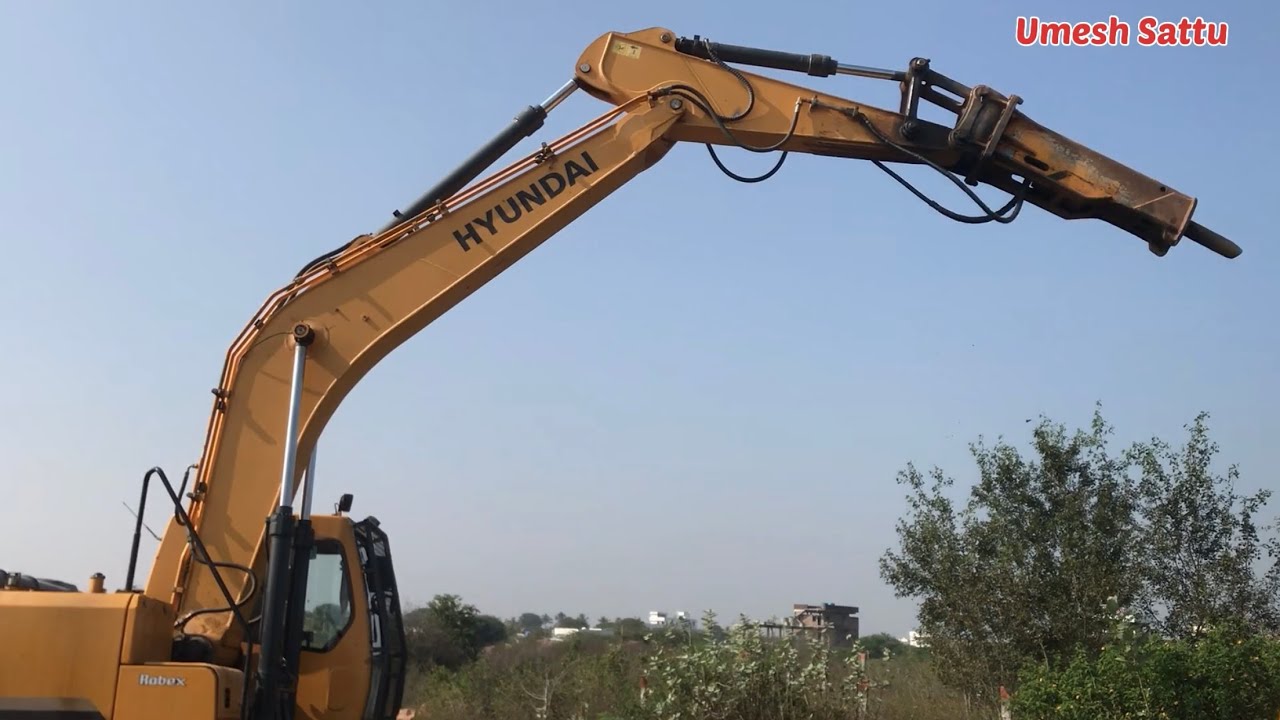 Hyundai smart 210 excavator changing loading bucket to hydraulic stone breaker