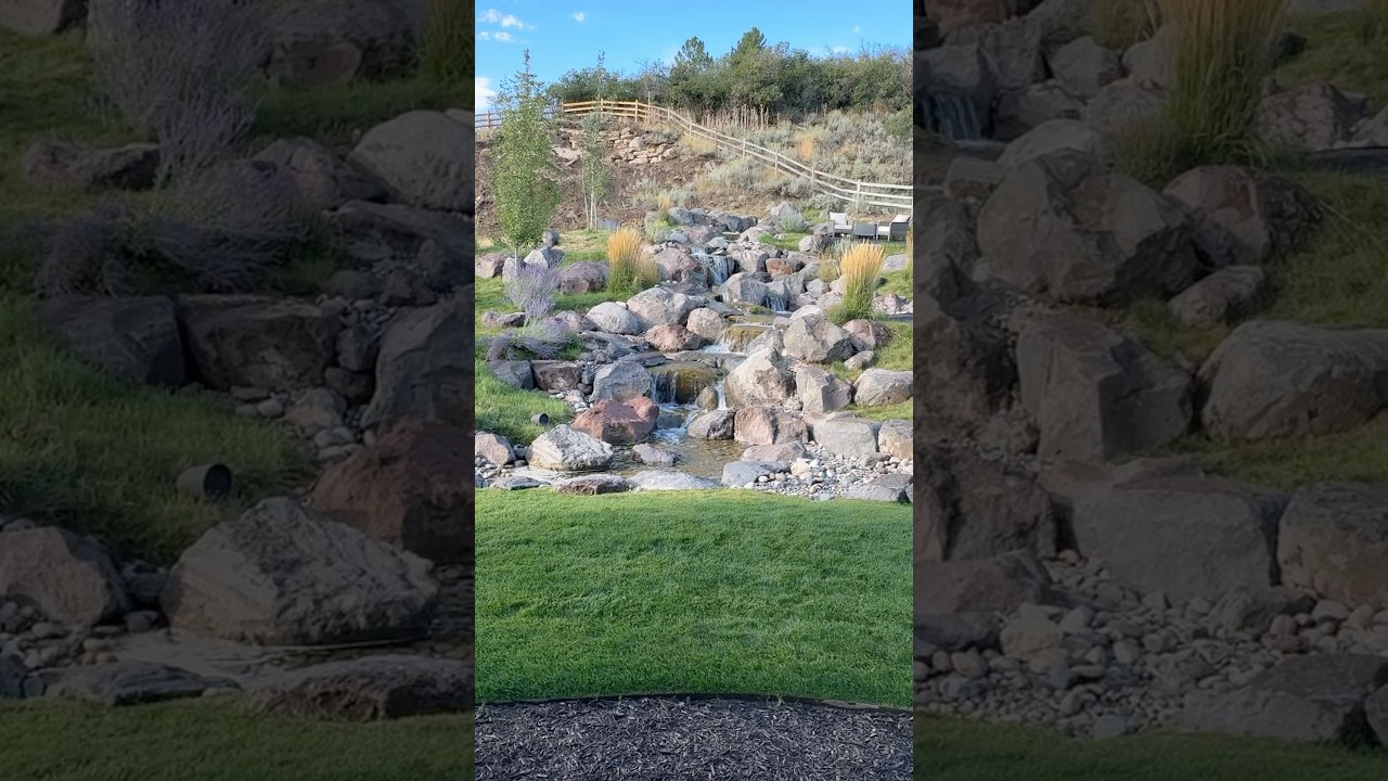 a massive pondless waterfall, built with 150 tons of boulders!