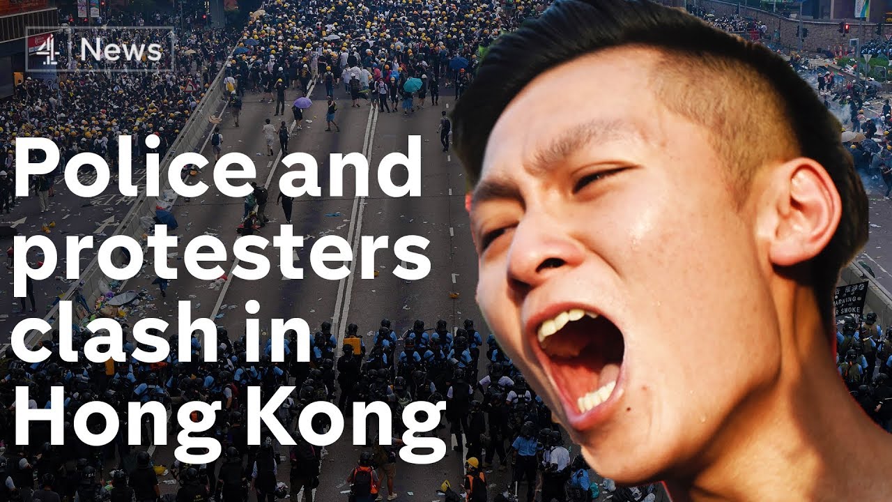 Hong Kong police fire tear gas at protesters after parliament chamber is stormed