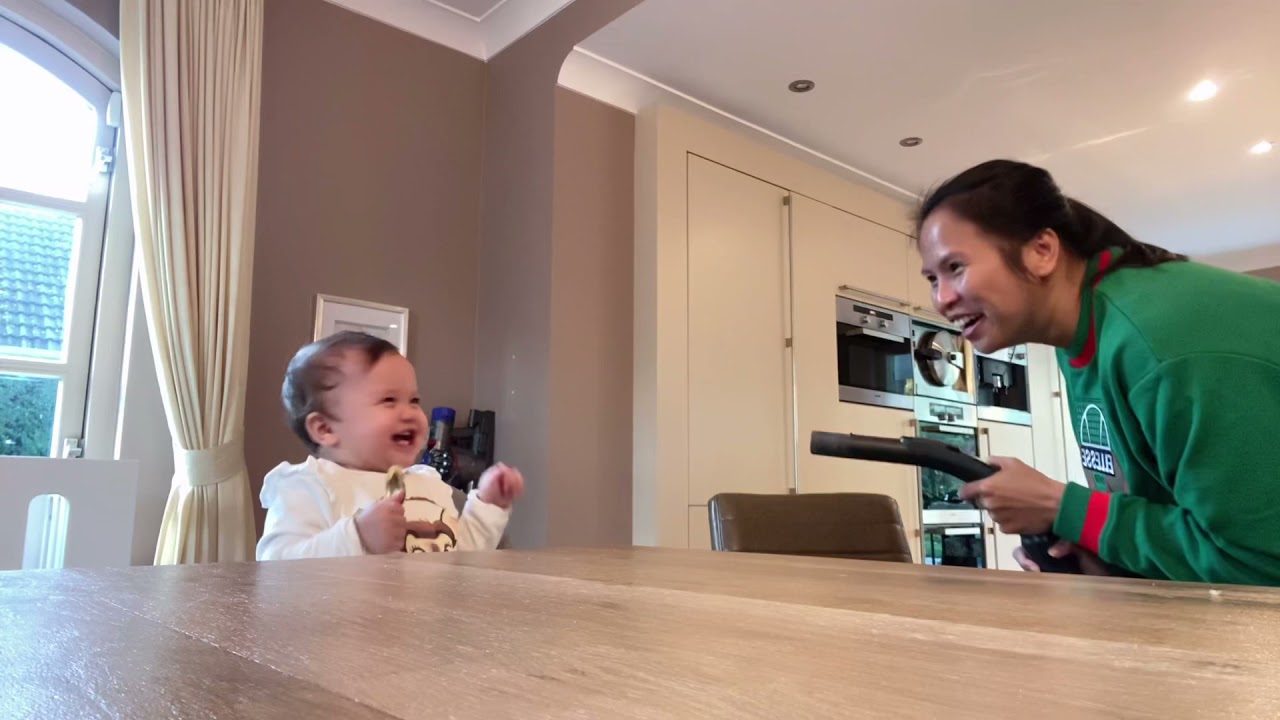 Baby Alana loves the vacuum cleaner