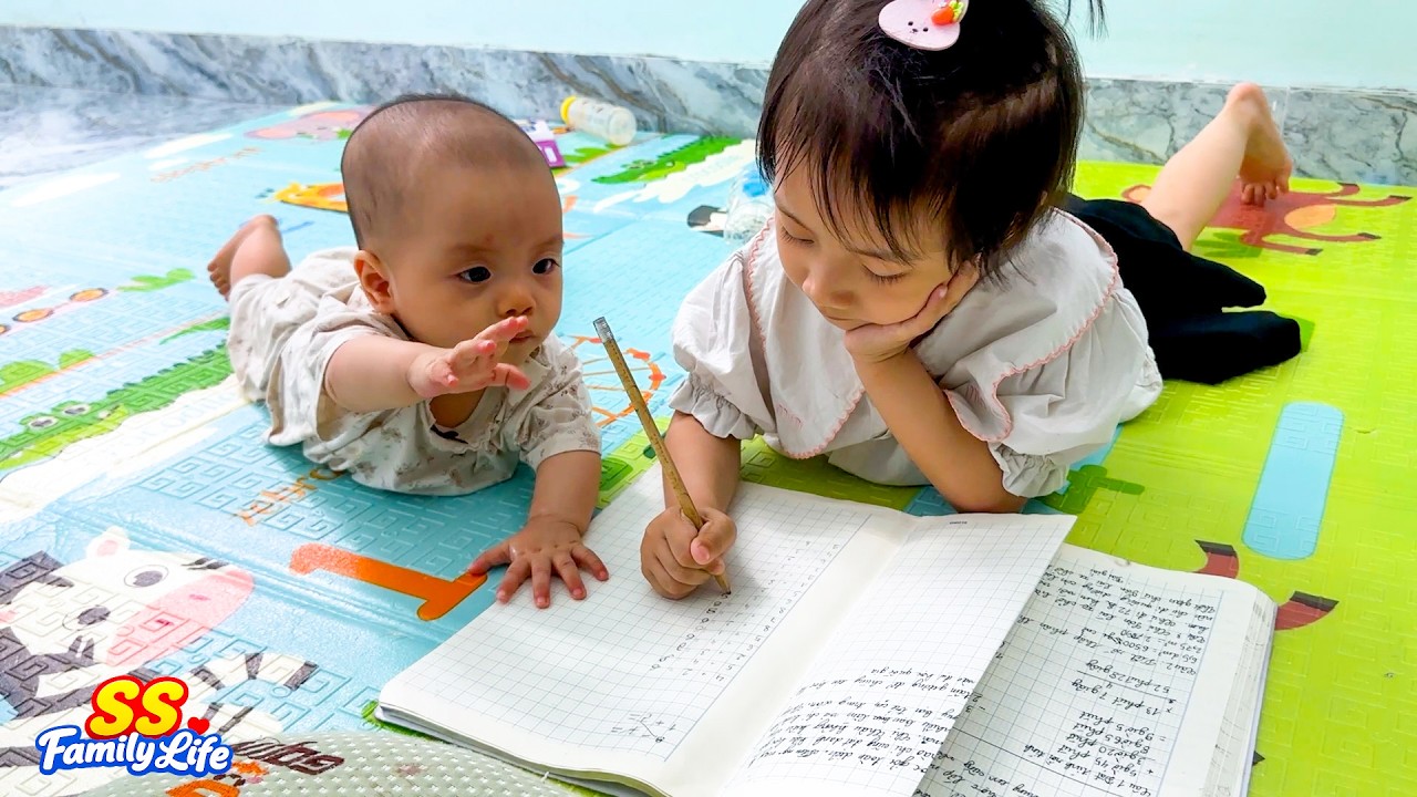 Diem studies while taking care of baby Kim when Mom is busy