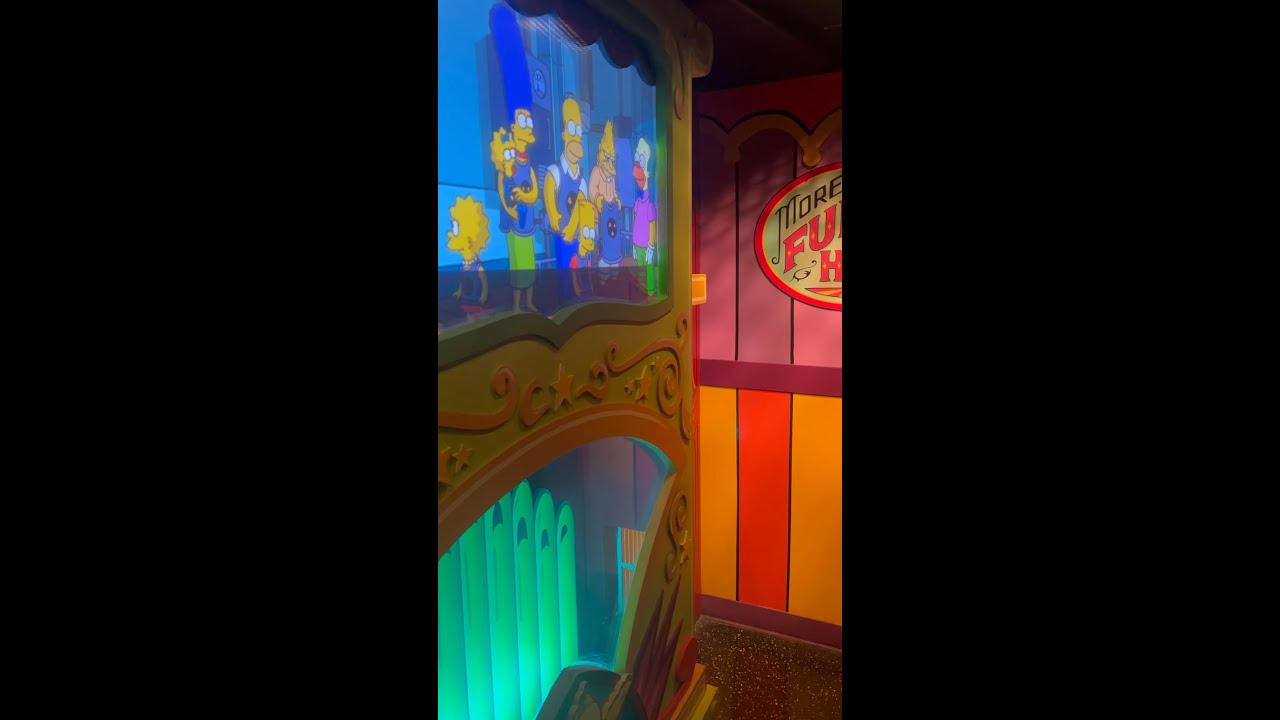 Simpsons ride on line.
