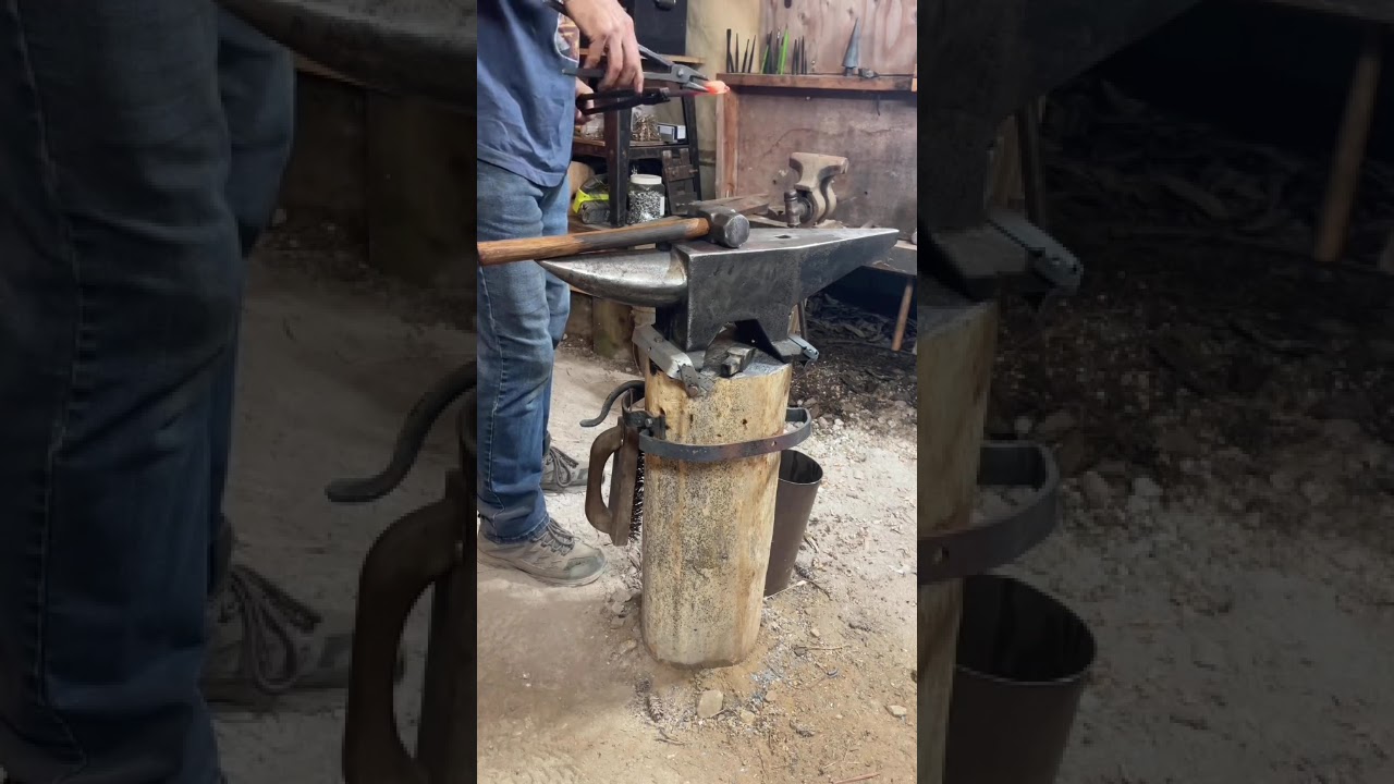 Forging a steel magic wand.