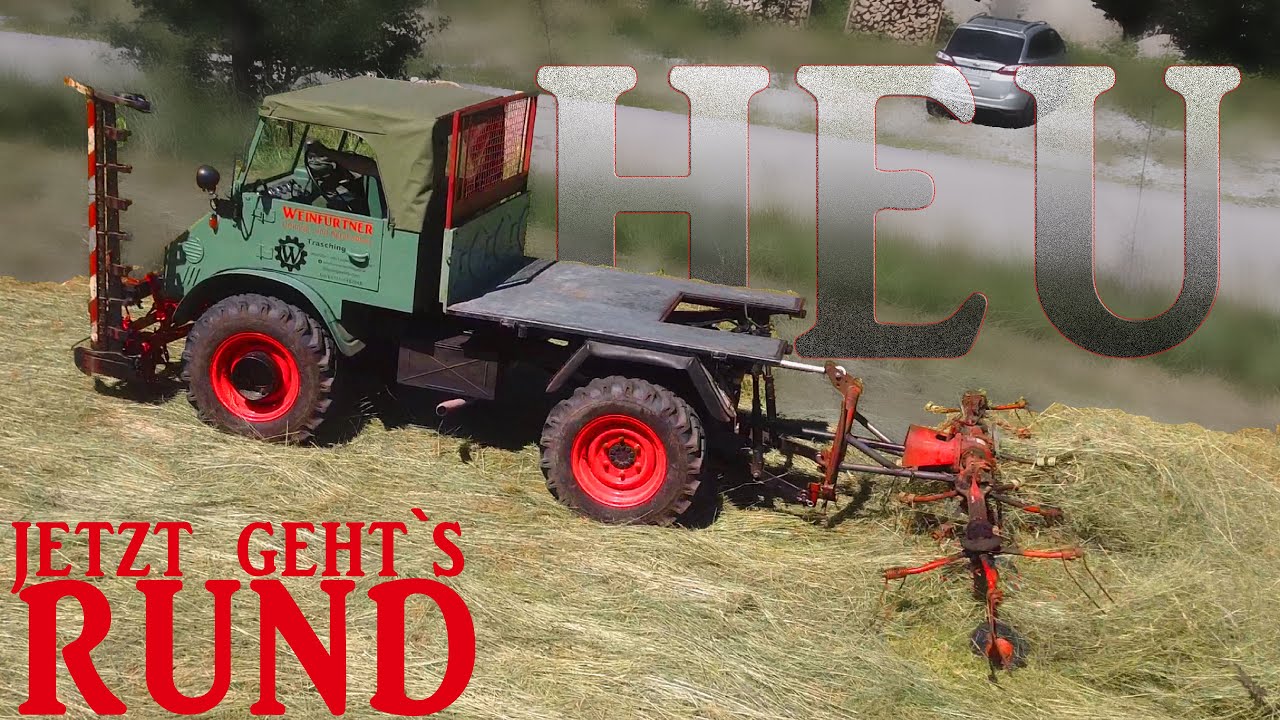 Im Hang: UNIMOG 411 beim Heuwenden mit optimiertem Fahr KH4 - wieder alles verregnet