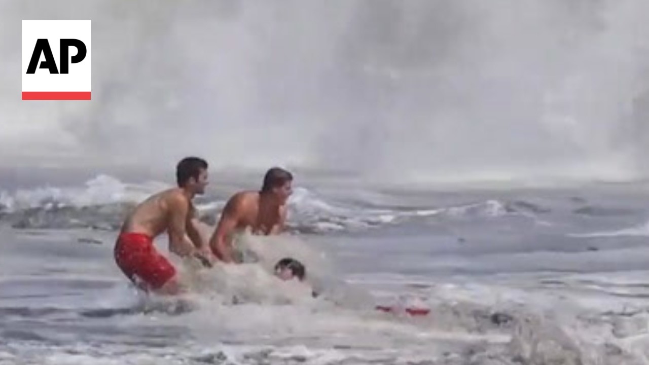 Father of child rescued from California waves says lifeguard risked 'his own safety'