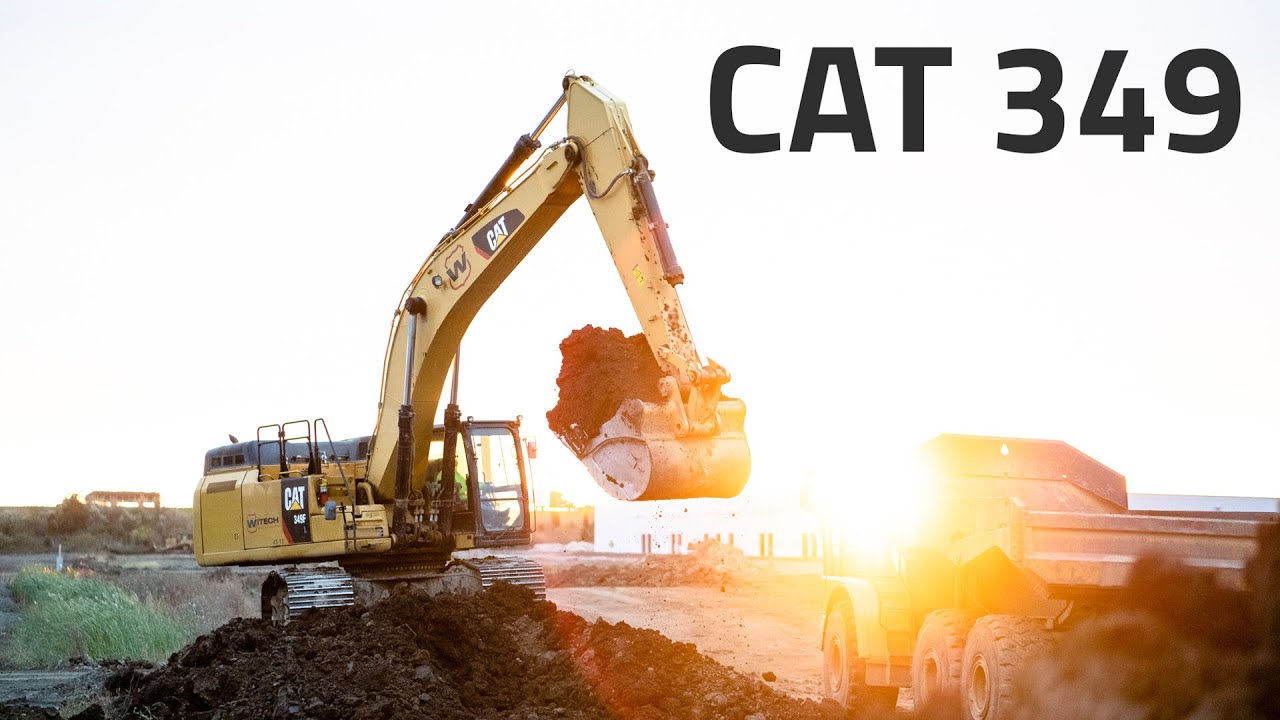 Caterpillar 349 Excavator Loading 740 Trucks
