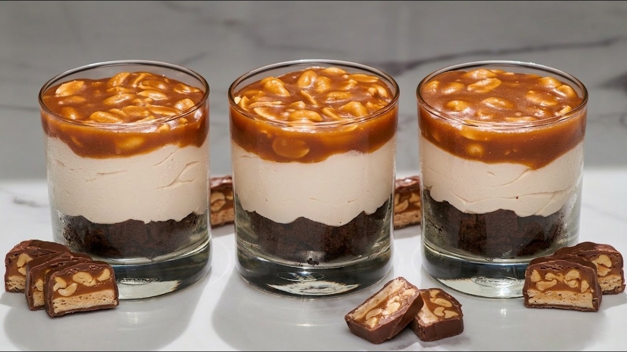 Amazing Snickers dessert. Brownie chocolate mousse trifles in cups.