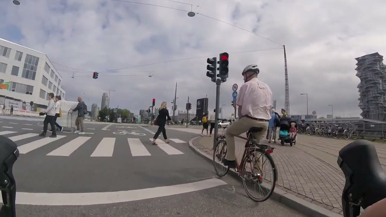 Bike Ride Through Copenhagen: Sunny Summer Afternoon with Looming Clouds