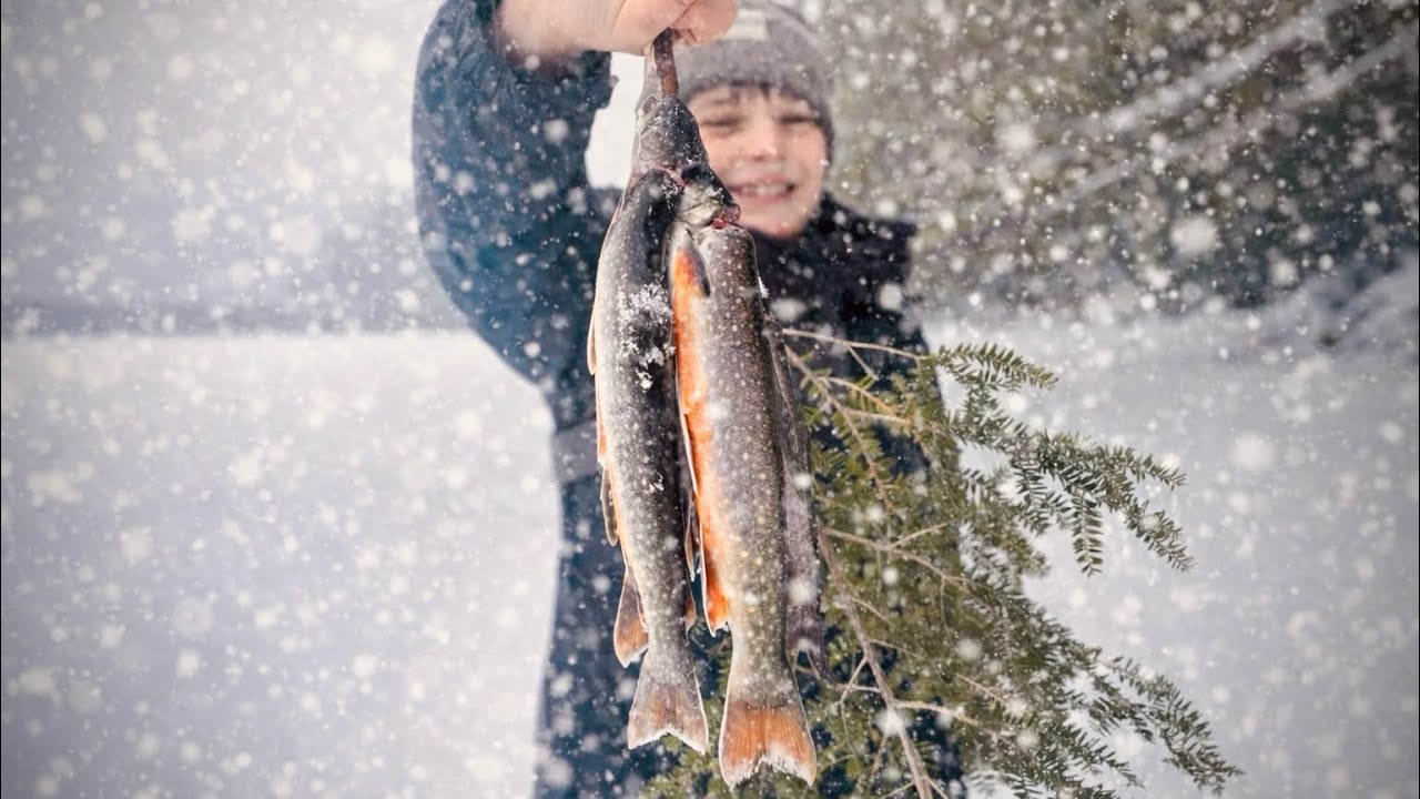 Trout fishing a pond in a BLIZZARD