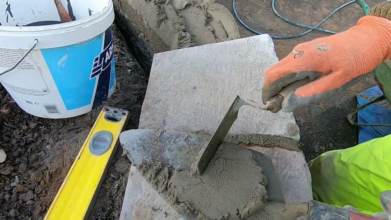 The Best way to fix capping stones to the Top of a Wall