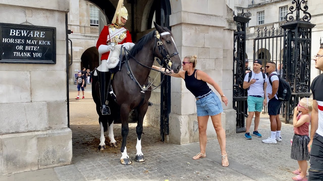 Lady Slips a Note in Horse Guards Boot