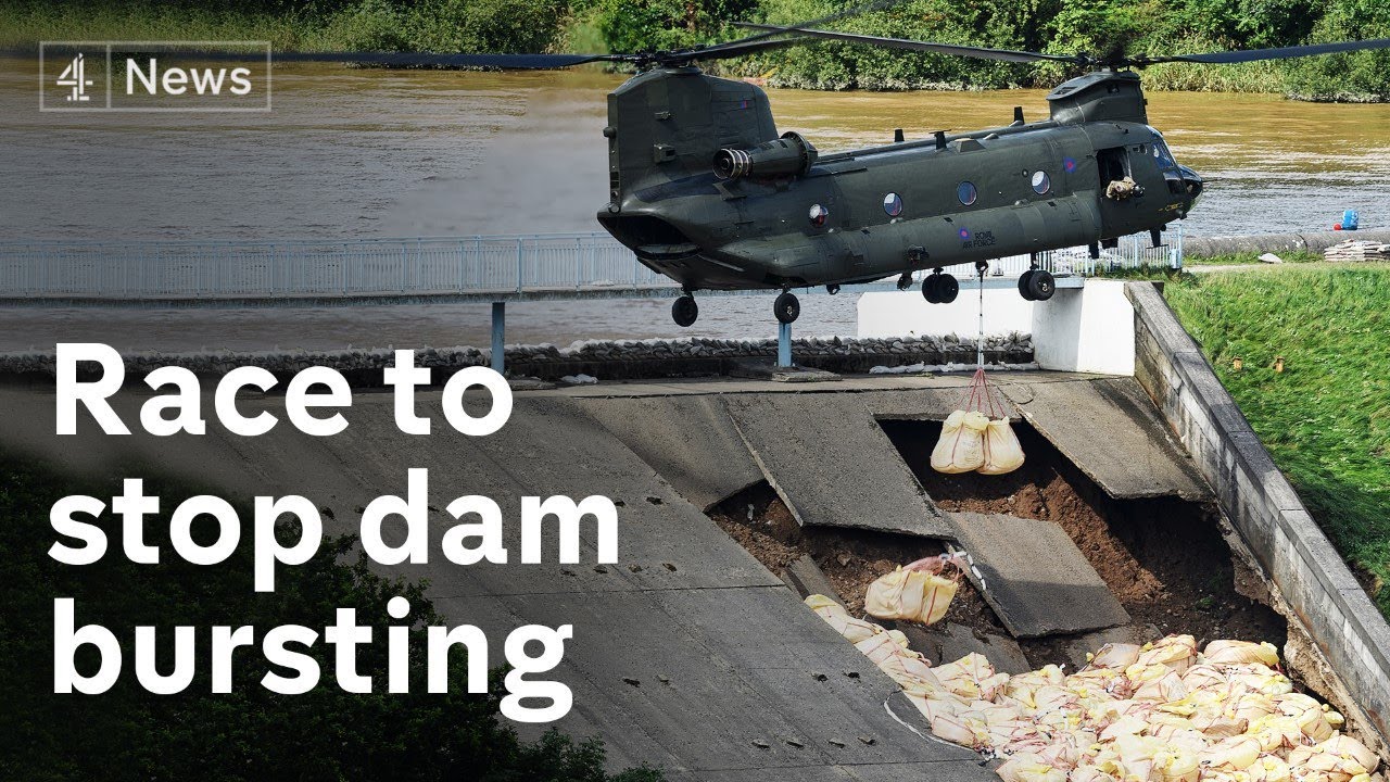 Town evacuated as dam damaged in heavy rains