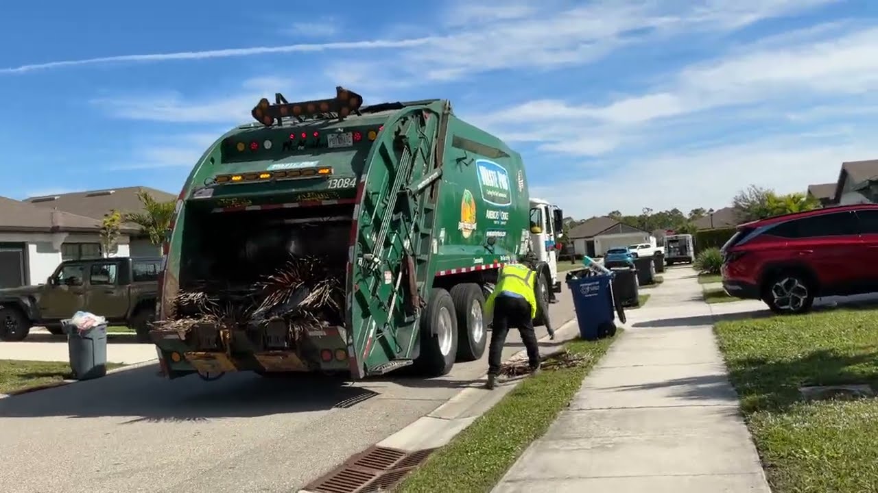A City of Lee County,Waste pro ACX rear loader McNeilus Diesel 13084 on yard waste