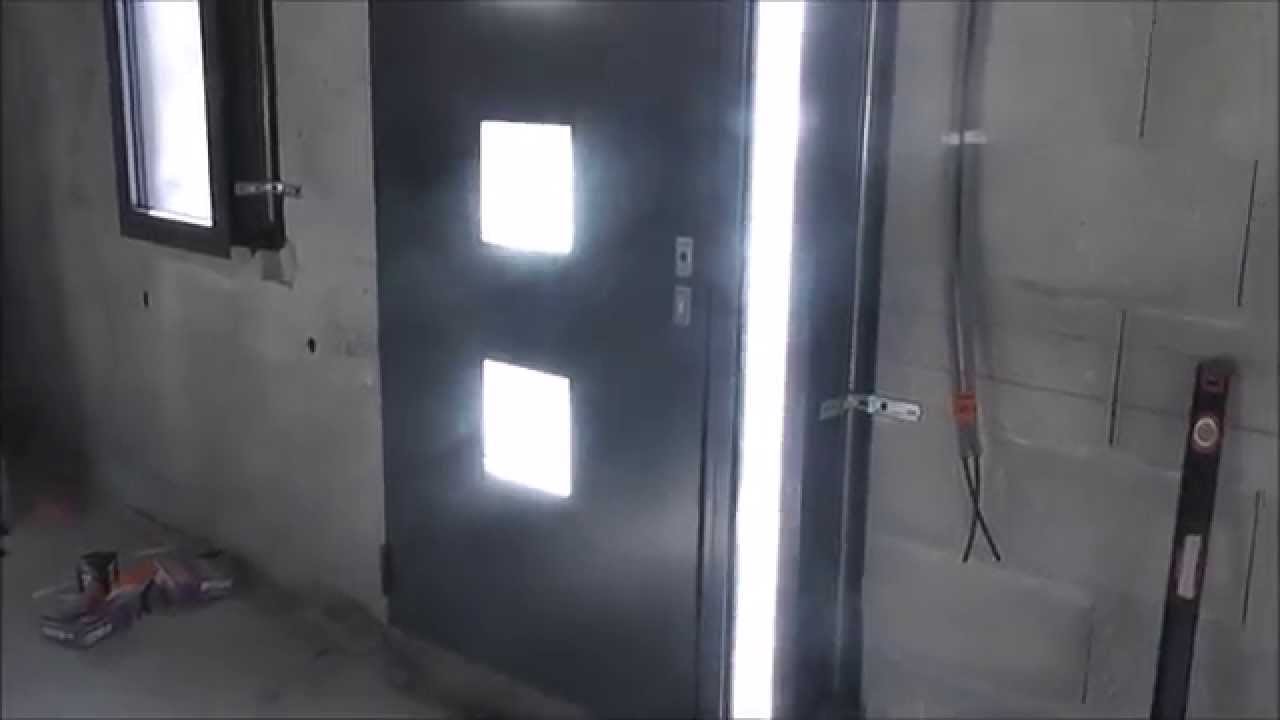 pose d'une porte d'entrée monobloc