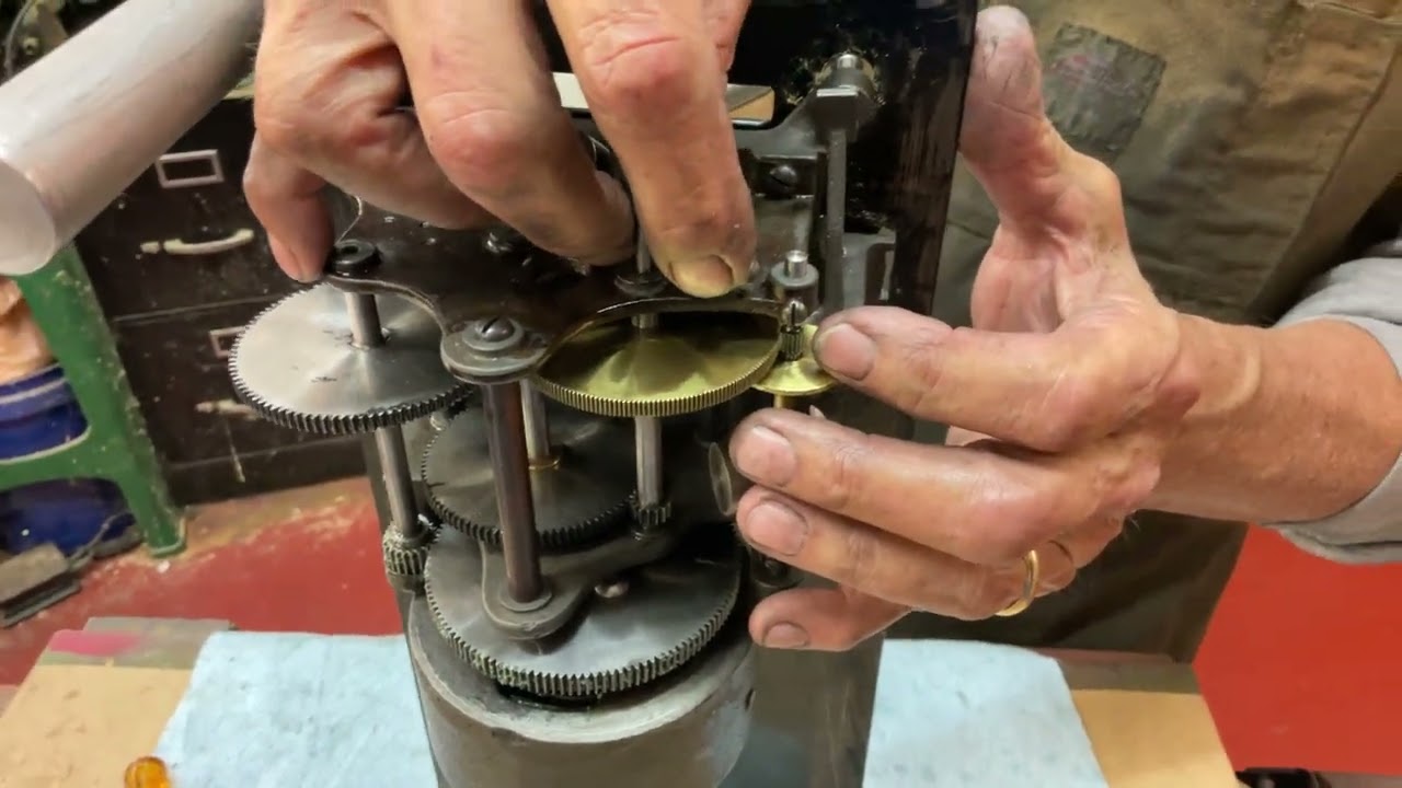 1235.  Installing and adjusting the speed control spring on an Edison phonograph ￼