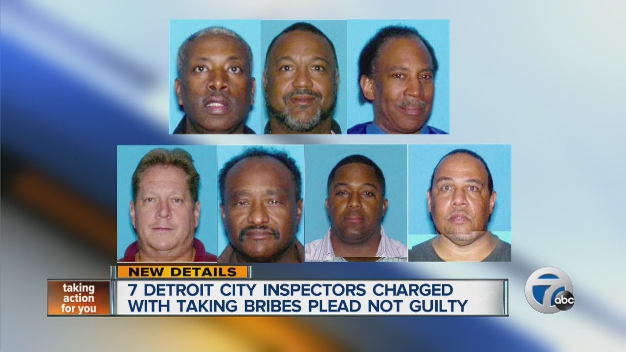 7 Detroit city inspectors charged with taking bribes plead not guilty