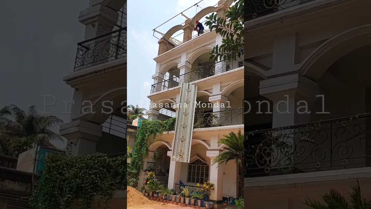 Lifting corrugated tin sheet from ground to top floor using rope and pulley method, technology video