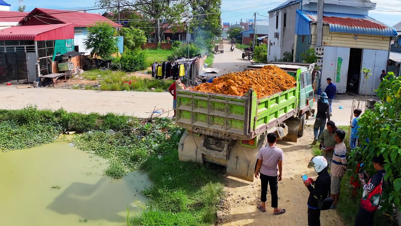 excellent landfilling build school project complete ,truck transport soil , bulldozer push soil