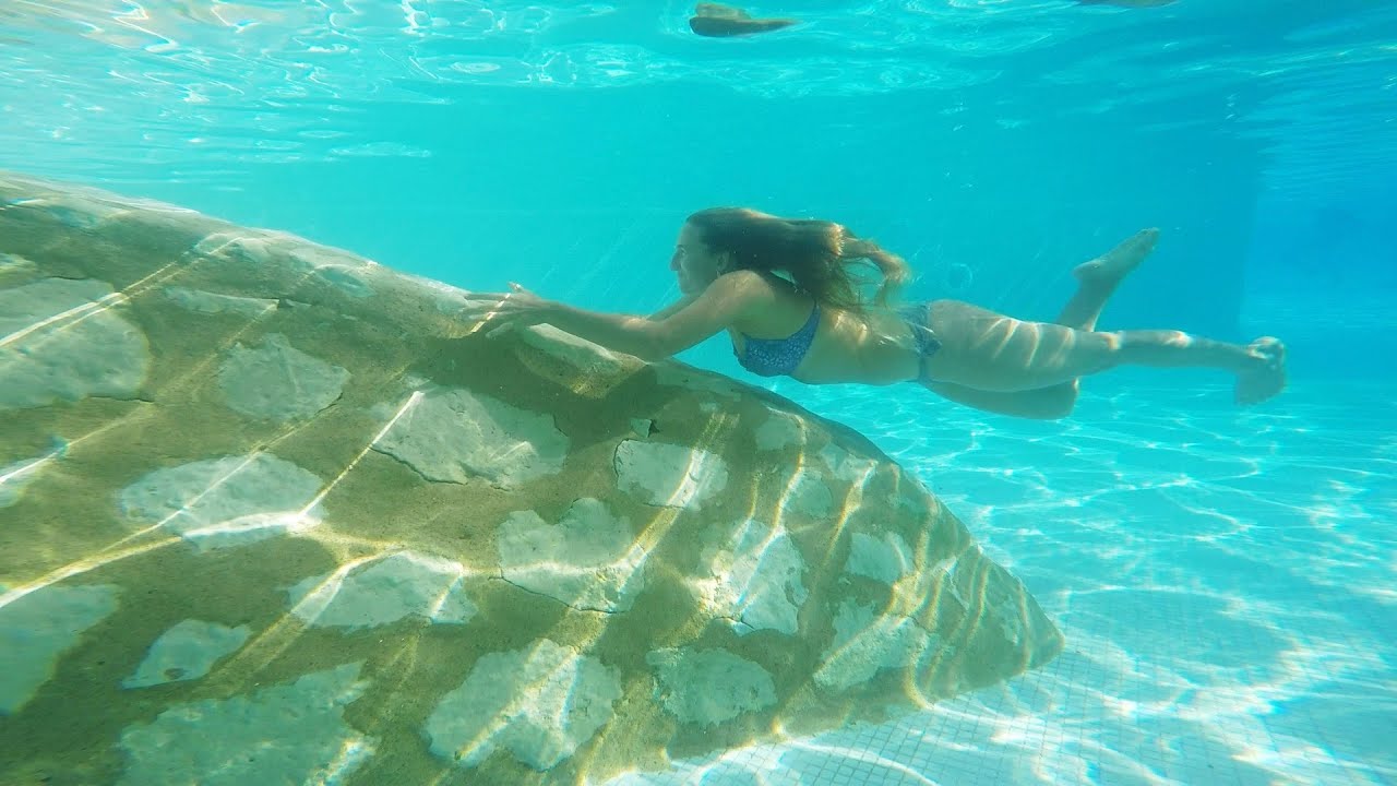 Swimming Underwater in Purple Bikini at Hotel Pool in Egypt