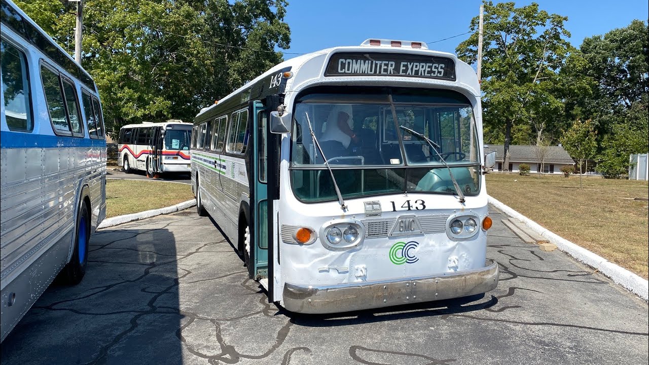 3 GMC flexible buses pulling into New Jersey historical ￼ bus festival.