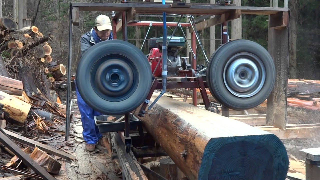 Homemade sawmill with car tires. I use car axles.