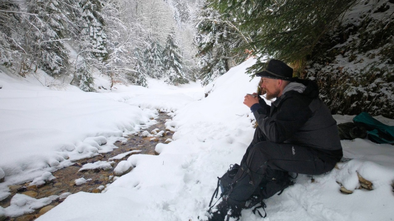 Walking alone through a snow-covered valley