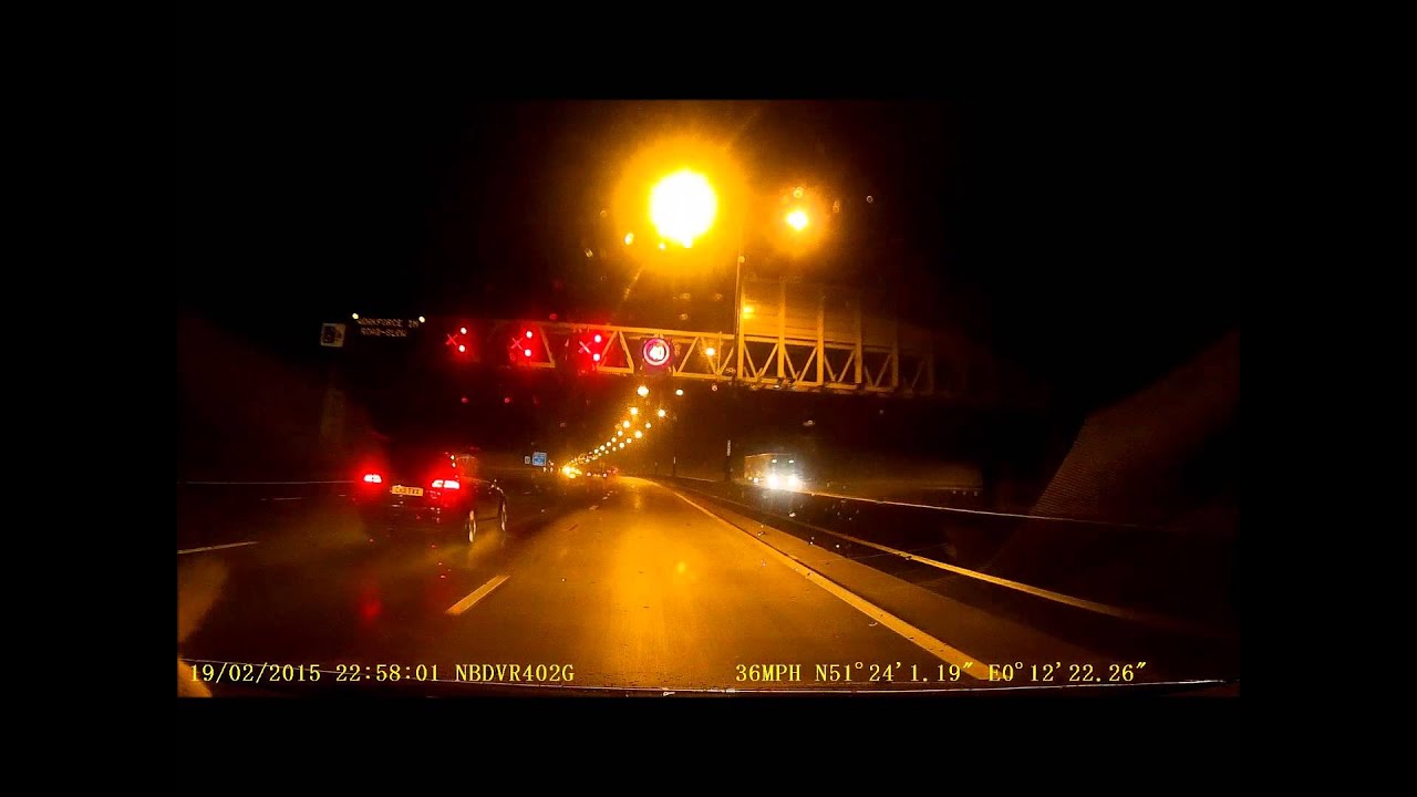 Cars undertaking - and going through red x lanes on M25 motorway