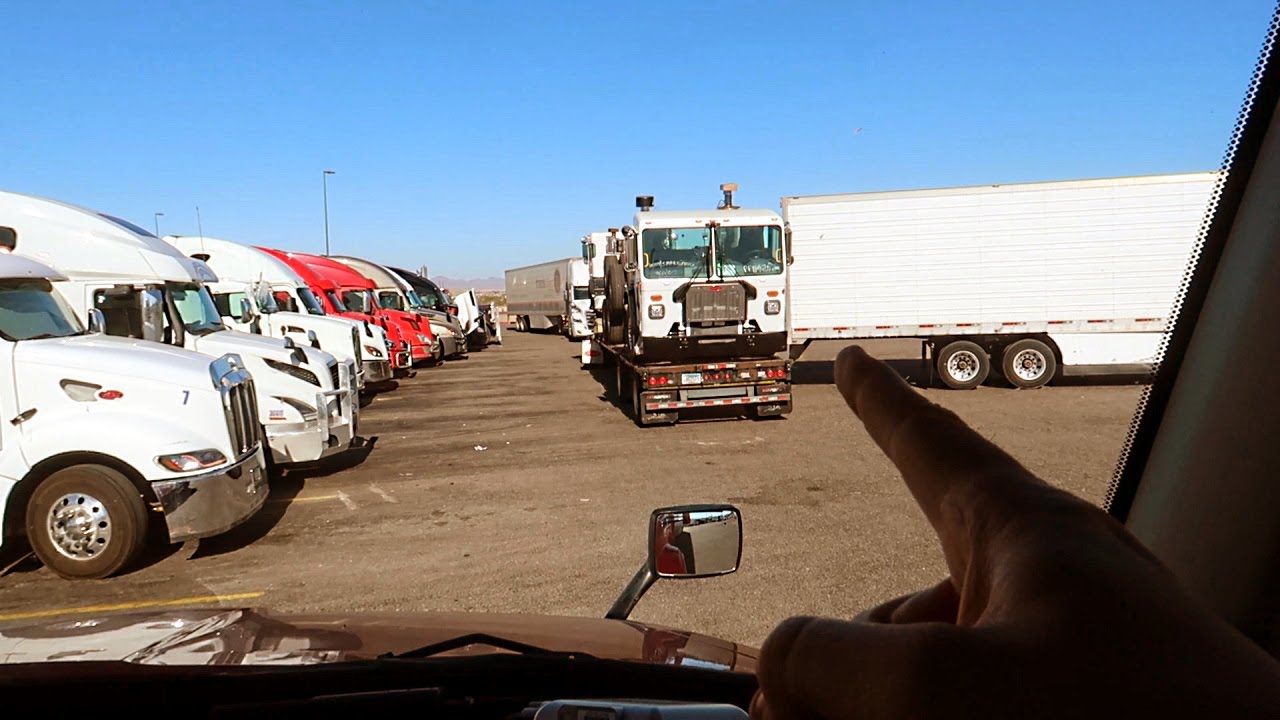Truck Stop Backing Craziness!  Never Pull Behind Backing Trucks!