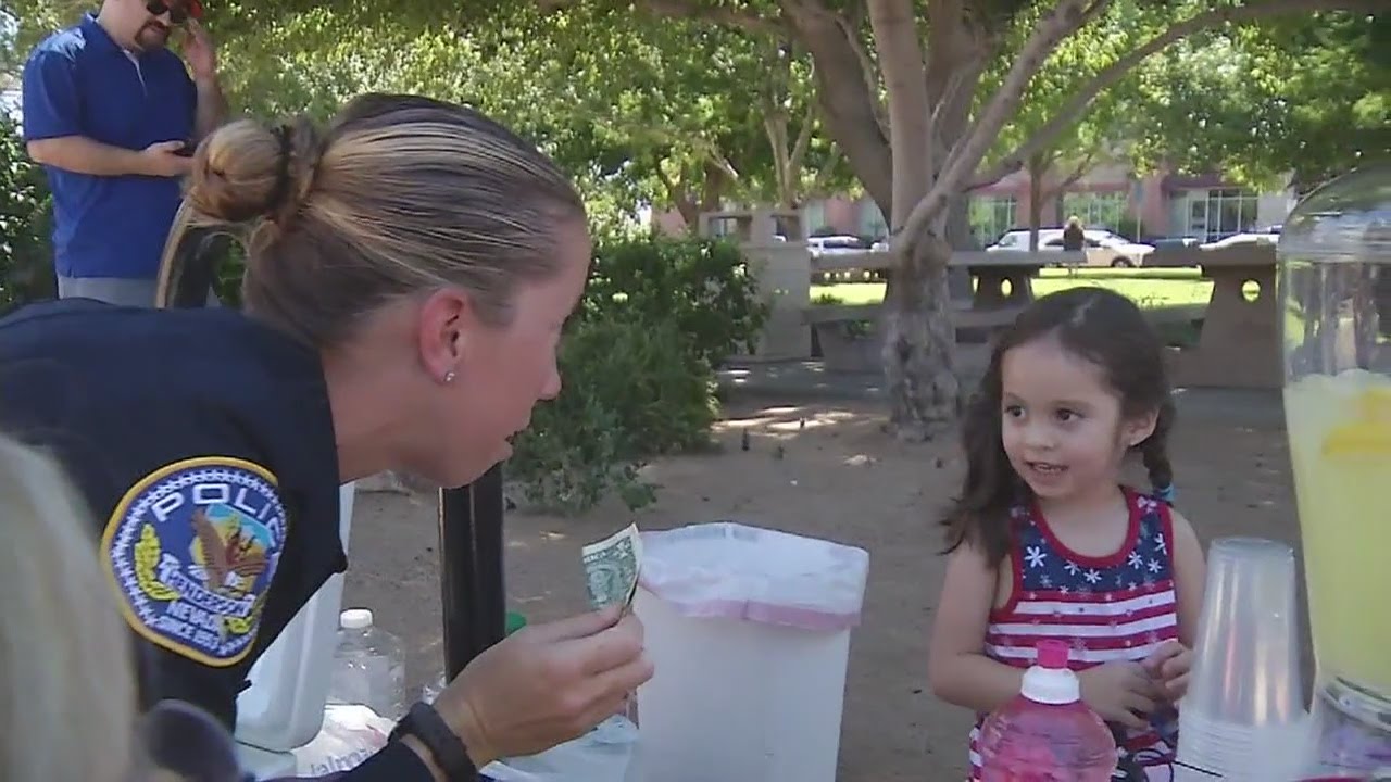 Little girl shows appreciation to local police with lemonade stand