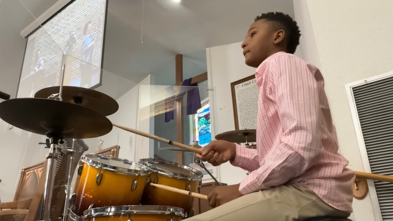 Playing the drums at church